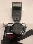 Clean Vintage Canon AE-1 Camera Body With Flash & Power Winder Strap. Fixed Price $200.00.