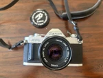 Vintage Canon AV-1 Camera With Toshiba ES-25L Flash. Fixed Price $150.00.