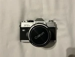 Chrome Canon Ftb-ql 35MM Slr Camera With 50MM F/1.8 Lens -minolta Elctroflash. Fixed Price $70.00.