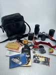 AV-1 Canon 35MM Camera, Telephoto Lens, Flash Attachment, Case. Fixed Price $151.00.