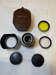 Voigtlander Lens Dynaron 1:4.5/100 Filters Bondle Metal Hood. Fixed Price $350.00.