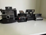 4 Polaroid CAMERAS-SX-70 Alpha 1, Land 100, Step Flash, One.. Fixed Price $130.00.