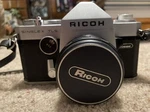 Ricoh Singlex Tls Film Camera With Rikenon 12.8 F=55MM Lens Neck Strap. Fixed Price $39.95.