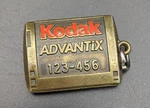 New Kodak Brass Advantix Keychain 123-456 Charm. Fixed Price $10.99.