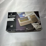Vtg Sharp EL-6200 Calculator / Organizer With Standing Sleeve (new ). Fixed Price $55.00.